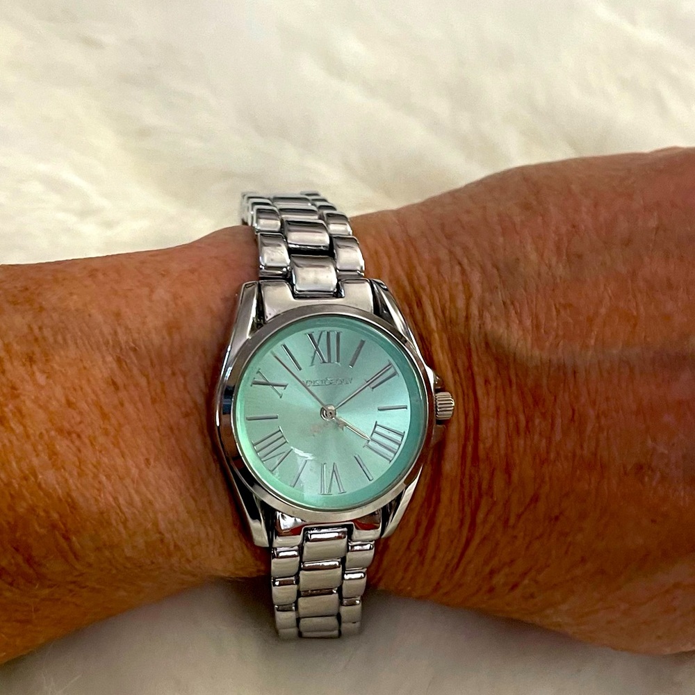 Wristology silver watch with greenish blue face